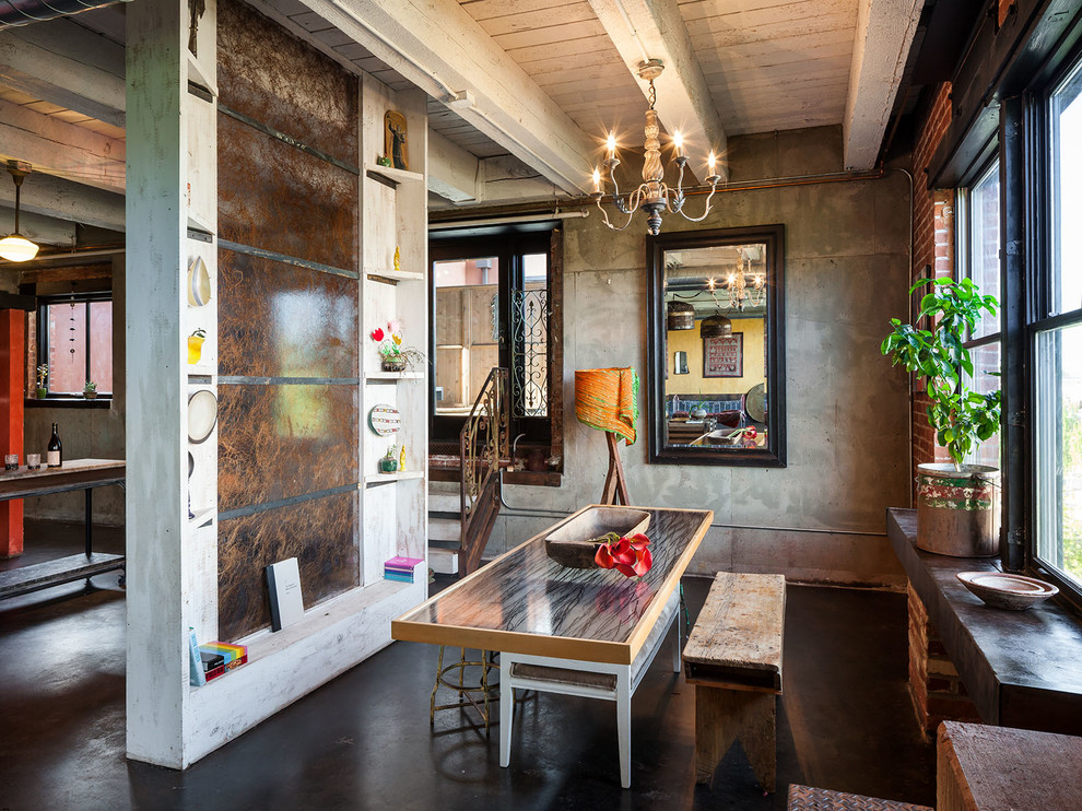 Example of a mid-sized urban concrete floor dining room design in Portland with no fireplace