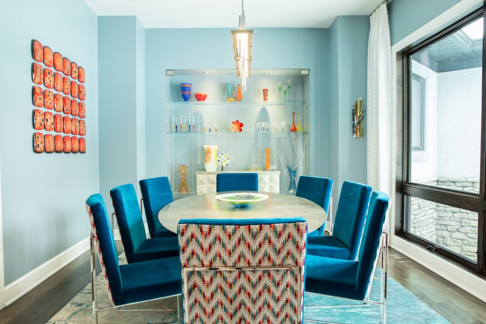 Inspiration for a contemporary dining room in Cleveland with blue walls, dark hardwood flooring and brown floors.
