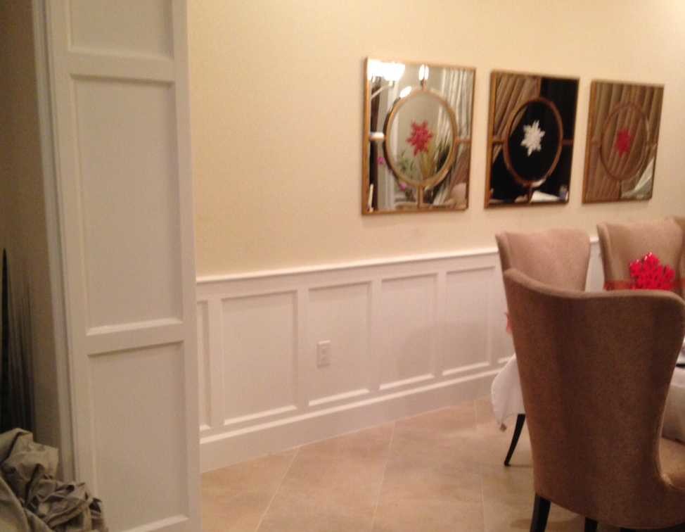 Mid-sized elegant medium tone wood floor enclosed dining room photo in Miami with green walls
