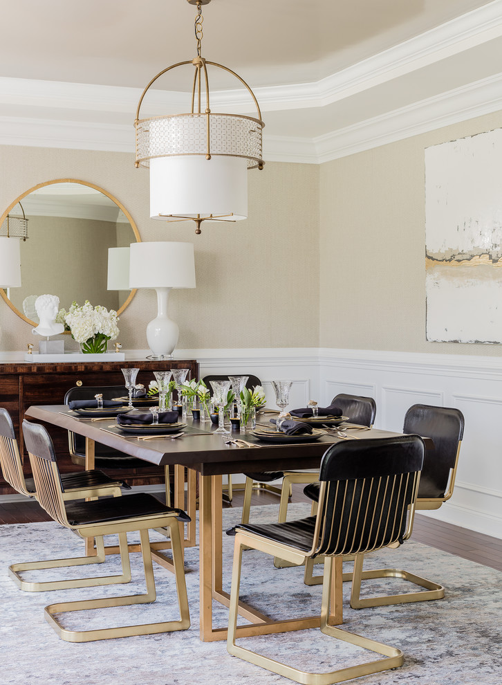 Photo of a medium sized classic enclosed dining room in Boston with brown floors, beige walls, medium hardwood flooring and feature lighting.