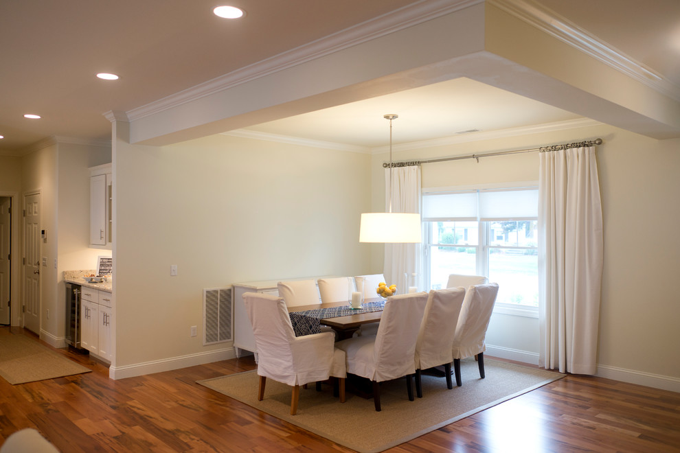 Medium sized classic open plan dining room in Providence with beige walls and dark hardwood flooring.