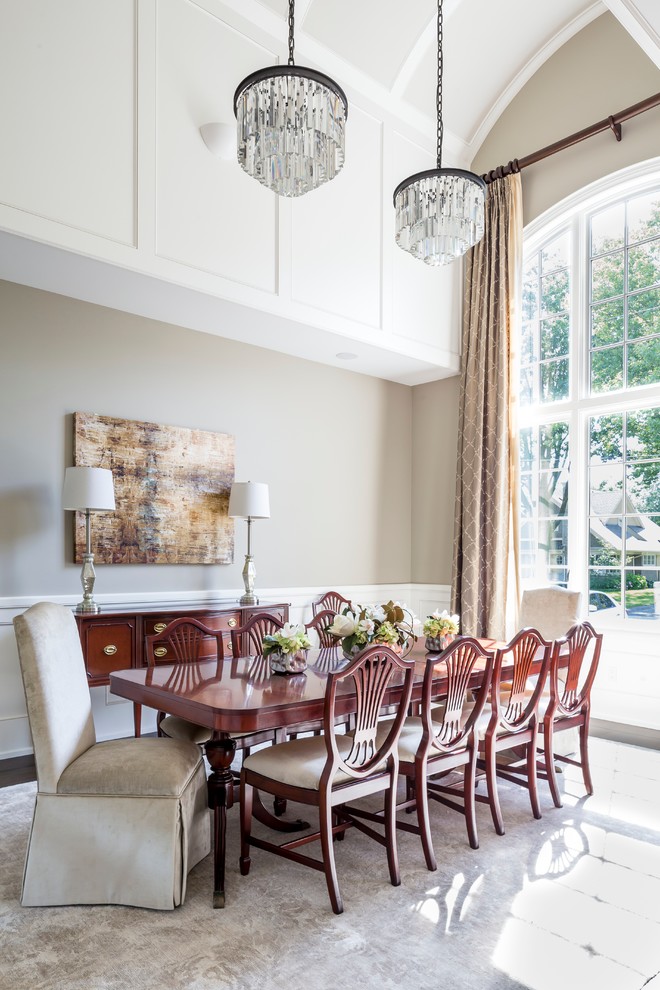 Example of a large classic enclosed dining room design in Toronto with gray walls