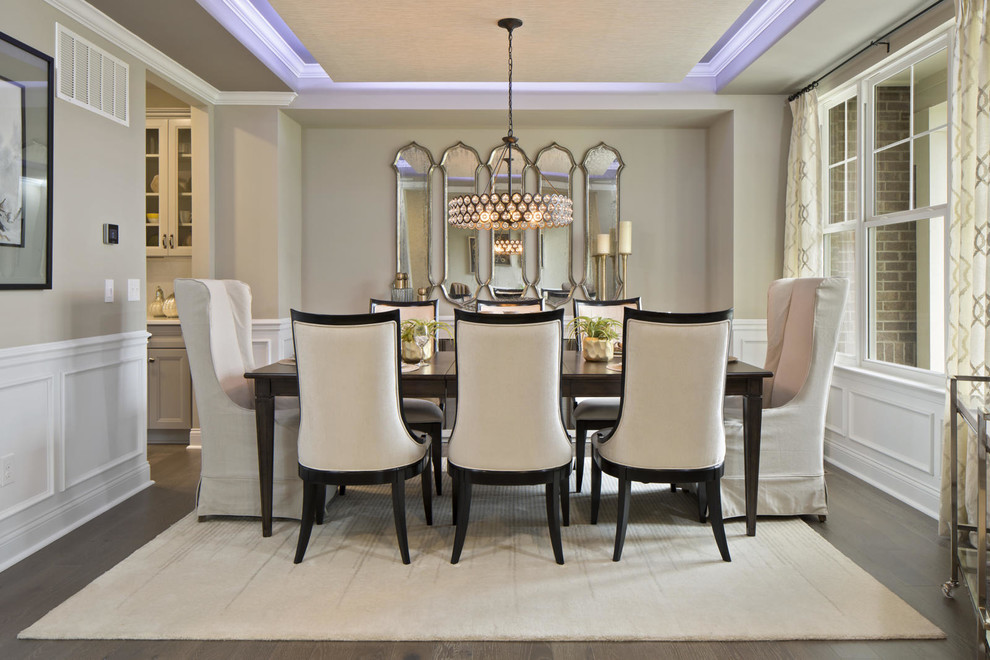 Photo of a large contemporary dining room in DC Metro with beige walls, dark hardwood flooring, no fireplace and brown floors.