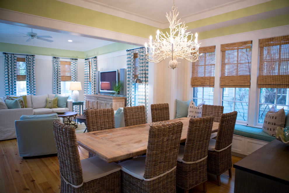 Photo of a medium sized beach style open plan dining room in Atlanta with green walls, medium hardwood flooring and no fireplace.