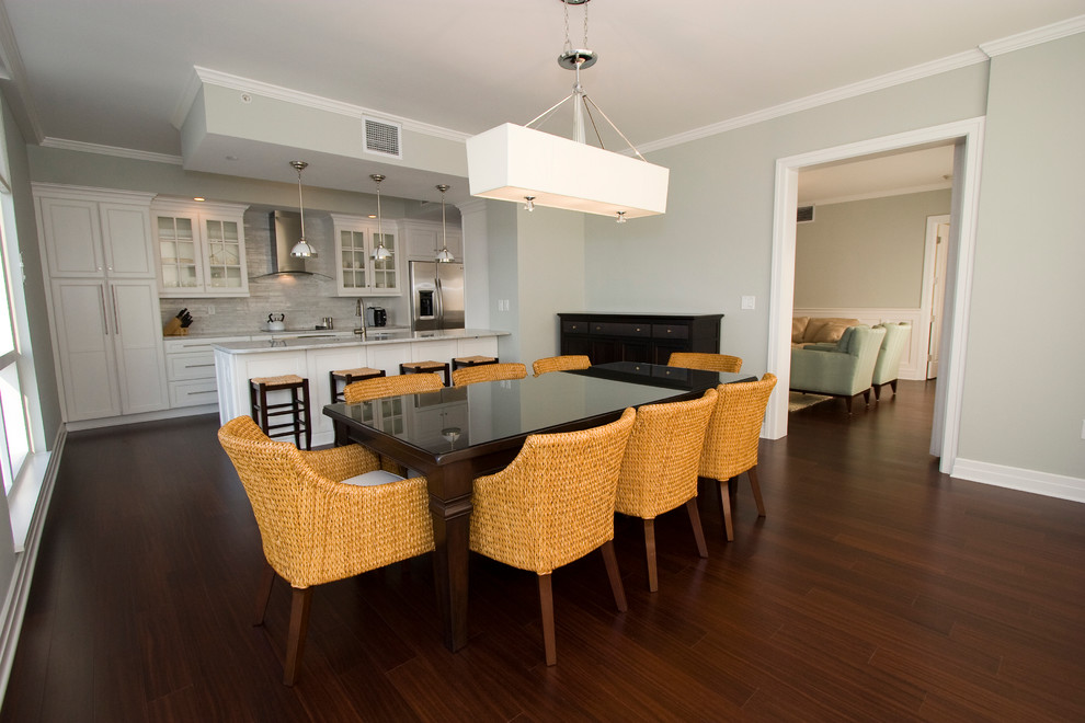 Example of a large classic dark wood floor dining room design in Tampa with gray walls