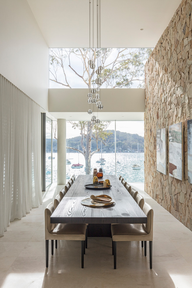 Enclosed dining room - coastal white floor enclosed dining room idea in Sydney with white walls