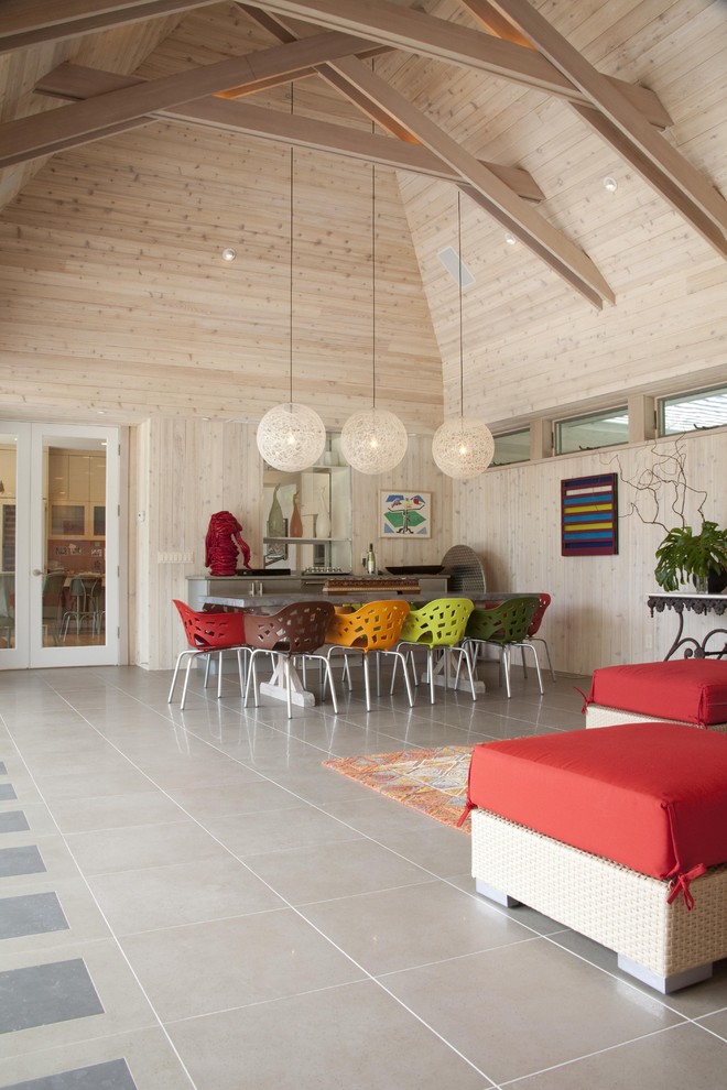 Esempio di una sala da pranzo aperta verso il soggiorno contemporanea con pavimento con piastrelle in ceramica