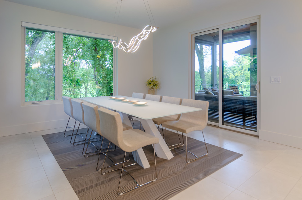 This is an example of a large contemporary kitchen/dining room in Other with white walls, porcelain flooring, no fireplace and white floors.
