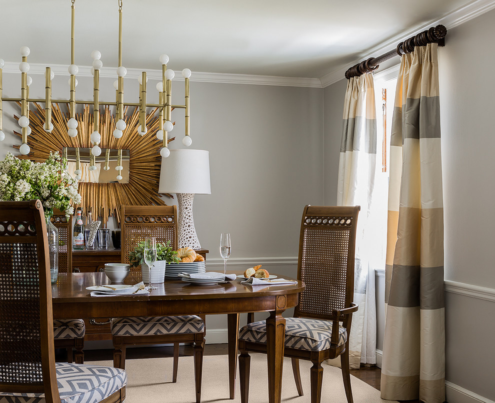 Example of a trendy dark wood floor dining room design in Boston with gray walls