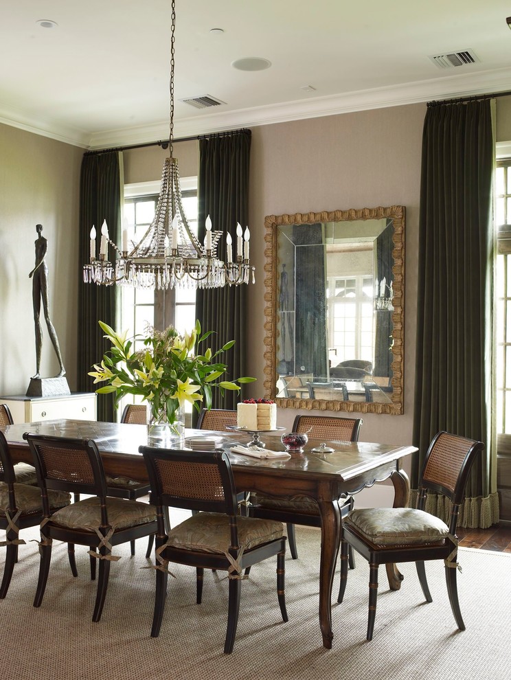 Photo of a medium sized traditional enclosed dining room in Houston with beige walls and dark hardwood flooring.