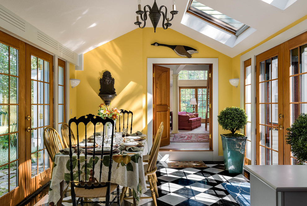 Inspiration for a medium sized farmhouse enclosed dining room in Portland Maine with yellow walls and marble flooring.