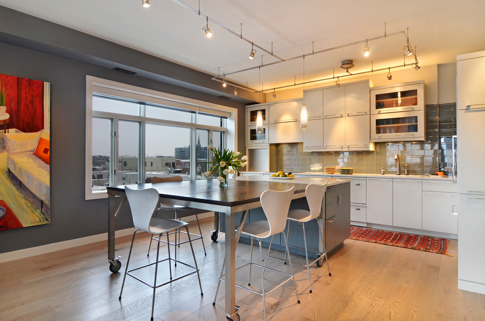 Kitchen/dining room combo - mid-sized contemporary light wood floor and brown floor kitchen/dining room combo idea in Chicago with gray walls and no fireplace