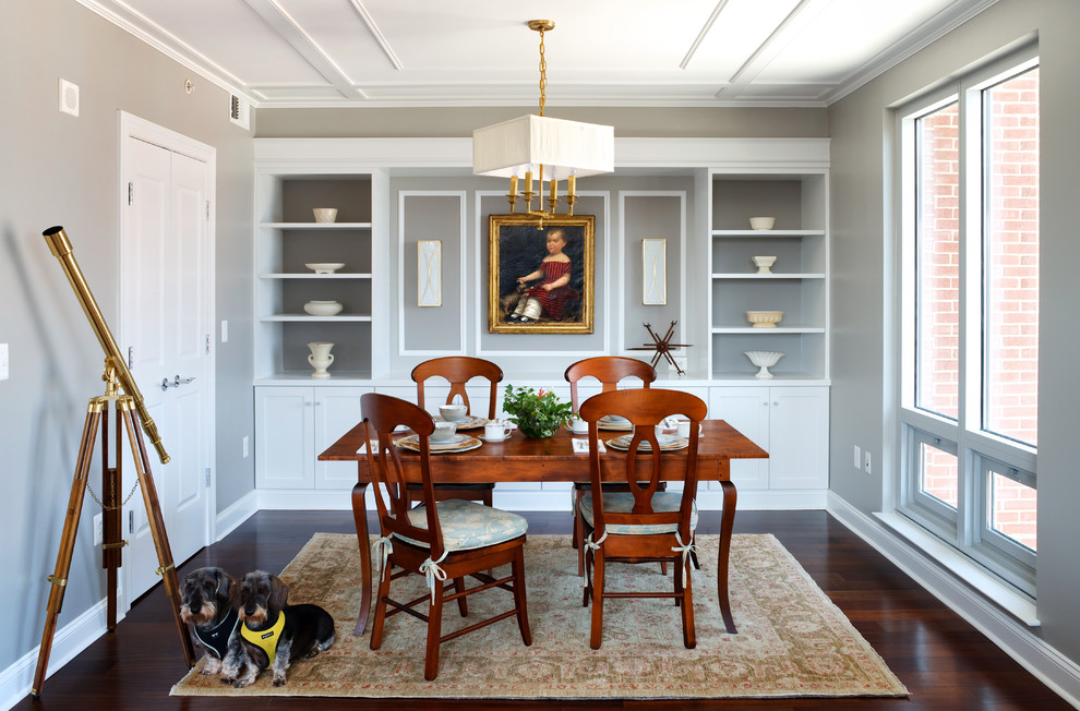 Photo of a traditional enclosed dining room in DC Metro with grey walls and dark hardwood flooring.