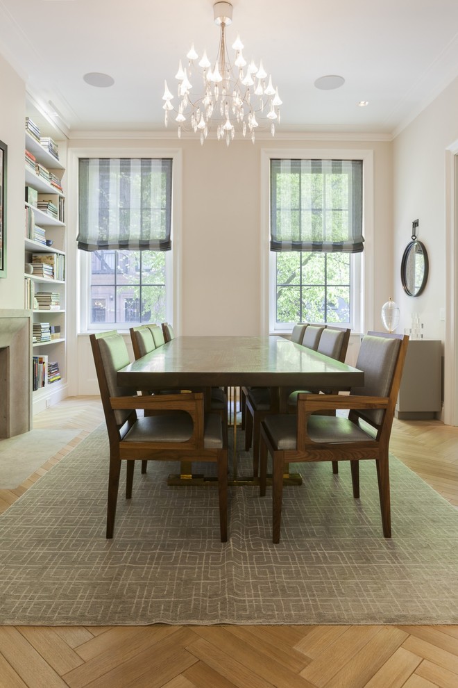 Inspiration for a contemporary dining room in New York with light hardwood flooring.