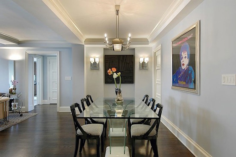 Medium sized contemporary open plan dining room in New York with grey walls and dark hardwood flooring.