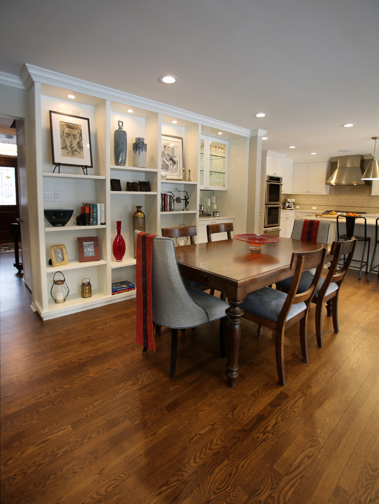 Example of a mid-sized transitional medium tone wood floor and brown floor kitchen/dining room combo design in Detroit with gray walls