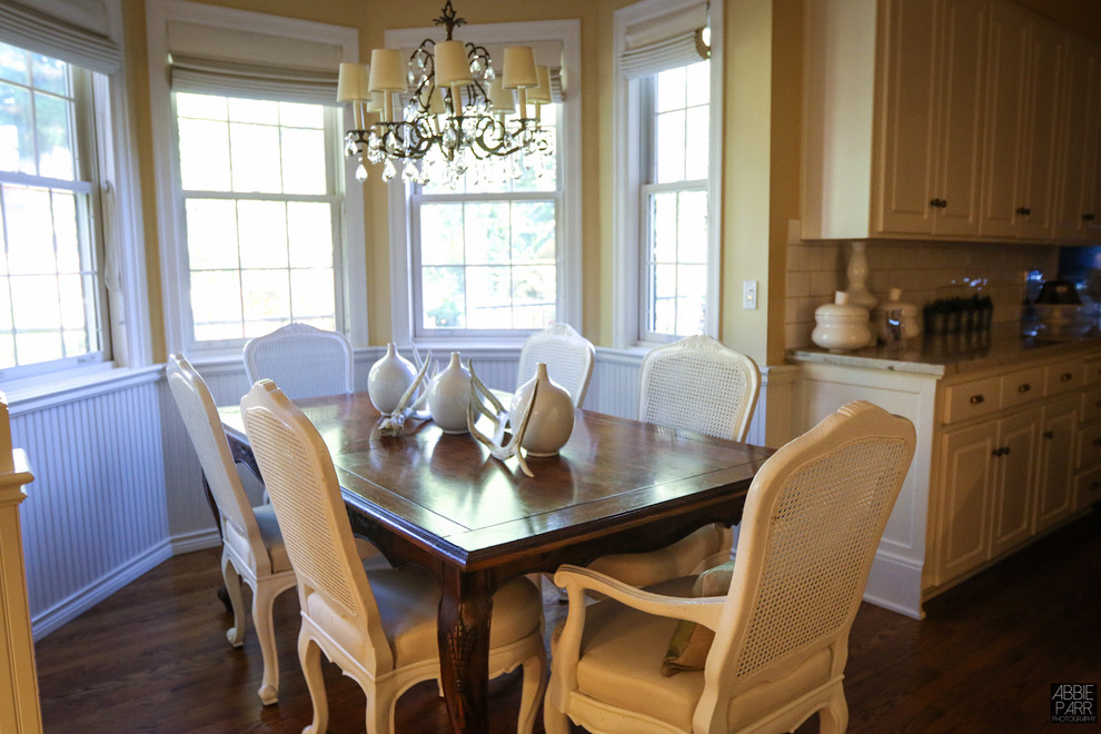Inspiration for a medium sized traditional enclosed dining room in Portland with yellow walls, dark hardwood flooring and no fireplace.