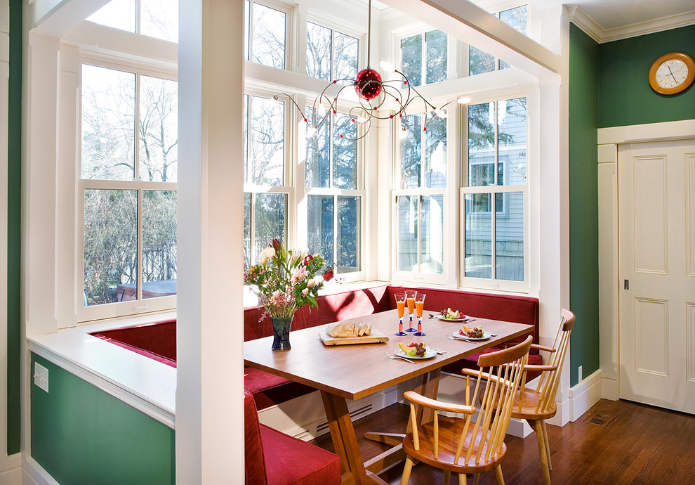 Inspiration for a mid-sized timeless medium tone wood floor and brown floor kitchen/dining room combo remodel in Boston with green walls and no fireplace
