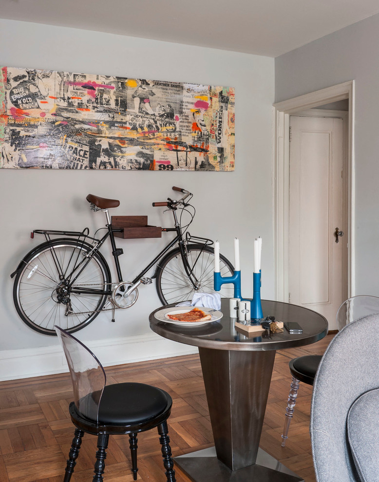 Dining room - mid-sized eclectic medium tone wood floor dining room idea in New York with gray walls