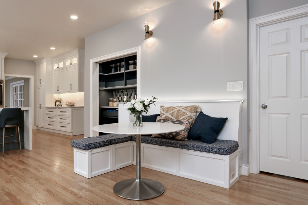 Inspiration for an expansive traditional kitchen/dining room in Boston with medium hardwood flooring.