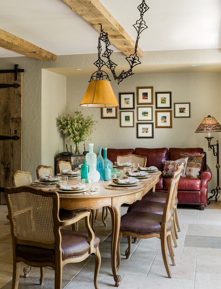 Tuscan limestone floor dining room photo in Boston with beige walls