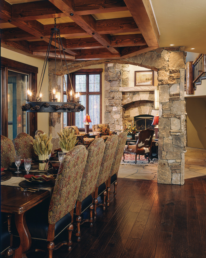 Inspiration for a large timeless great room remodel in Denver with beige walls, a standard fireplace and a stone fireplace
