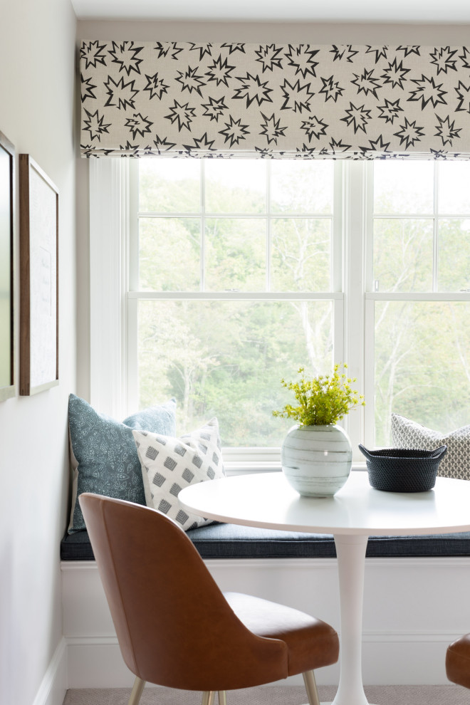 Photo of a small traditional kitchen/dining room in Boston with white walls, no fireplace and grey floors.