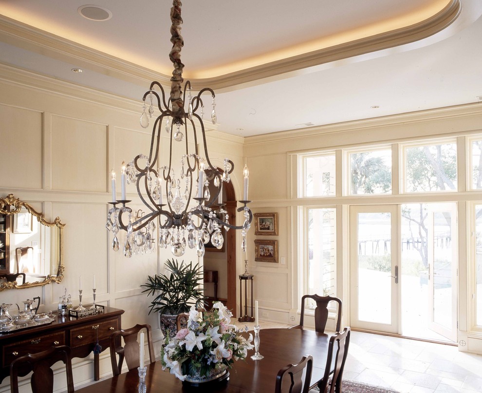 Design ideas for a large classic enclosed dining room in Atlanta with beige walls, limestone flooring and no fireplace.