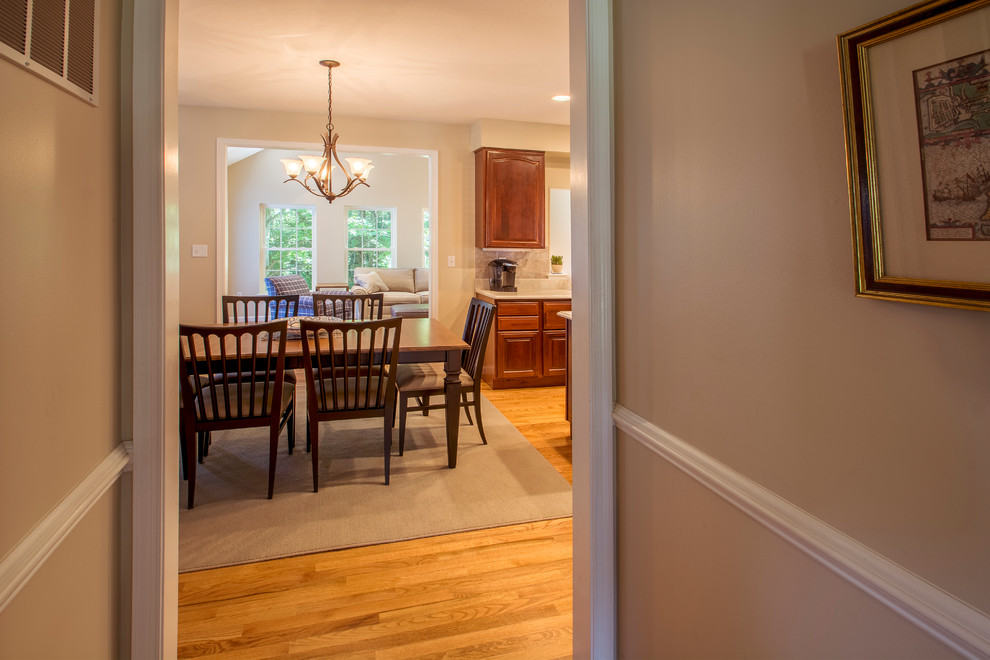 Kitchen/dining room combo - mid-sized traditional light wood floor and beige floor kitchen/dining room combo idea in Other with beige walls and no fireplace