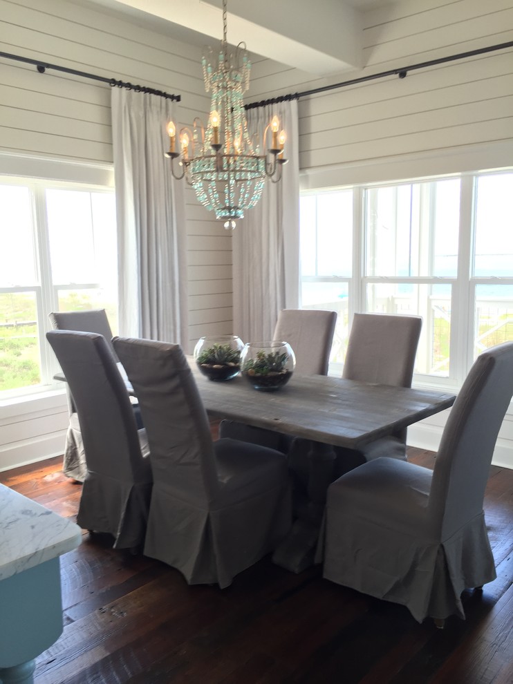 Inspiration for a small beach style open plan dining room in Atlanta with white walls, dark hardwood flooring, no fireplace and brown floors.