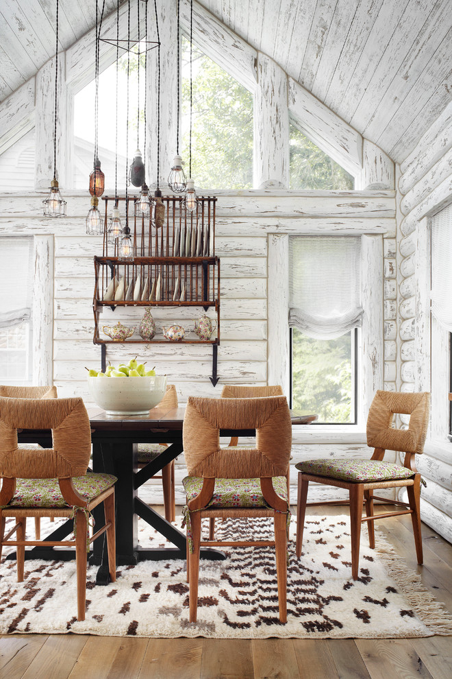 Inspiration for a rustic dark wood floor dining room remodel in Milwaukee