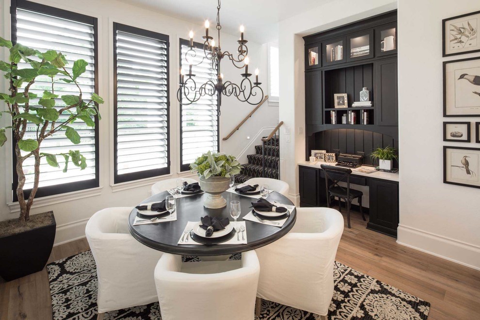 Inspiration for a transitional light wood floor and beige floor dining room remodel in Dallas with white walls and no fireplace