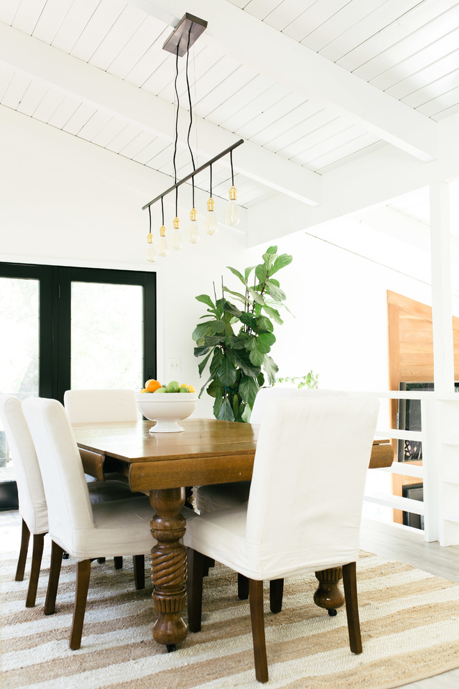 Inspiration for a classic open plan dining room in Sacramento with white walls.