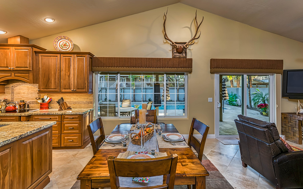 Photo of a medium sized traditional open plan dining room in Phoenix with beige walls and travertine flooring.