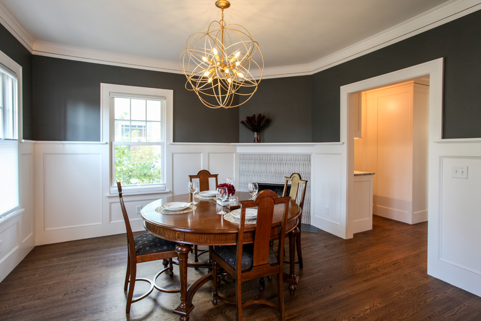 Mid-sized elegant medium tone wood floor and brown floor enclosed dining room photo in Minneapolis with a corner fireplace, a tile fireplace and gray walls