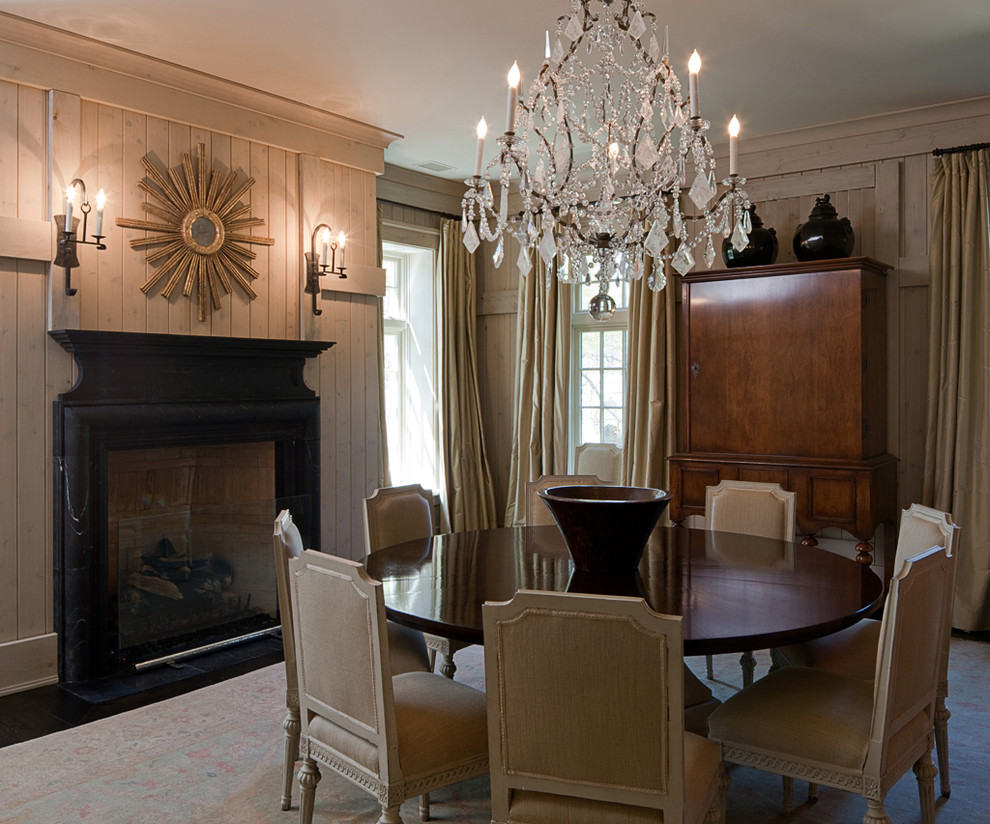 Inspiration for a large traditional enclosed dining room in Atlanta with grey walls, dark hardwood flooring, a standard fireplace, a stone fireplace surround and brown floors.