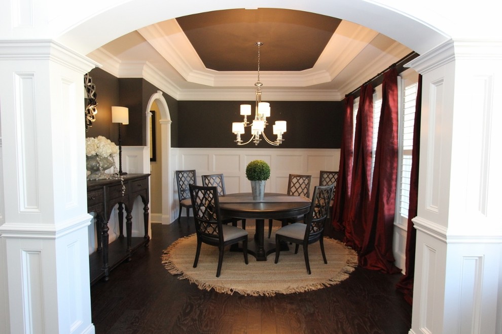 This is an example of a large contemporary enclosed dining room in Raleigh with brown walls and dark hardwood flooring.