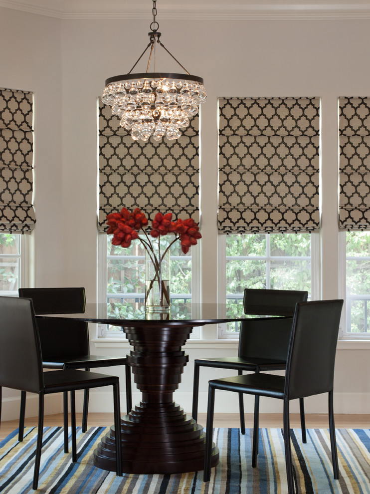 Example of a trendy medium tone wood floor and multicolored floor dining room design in San Francisco with gray walls