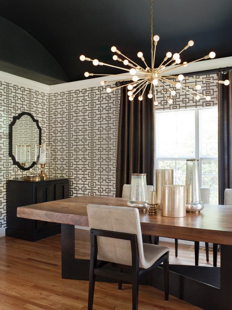 Inspiration for a mid-sized transitional medium tone wood floor and brown floor enclosed dining room remodel in San Francisco with multicolored walls