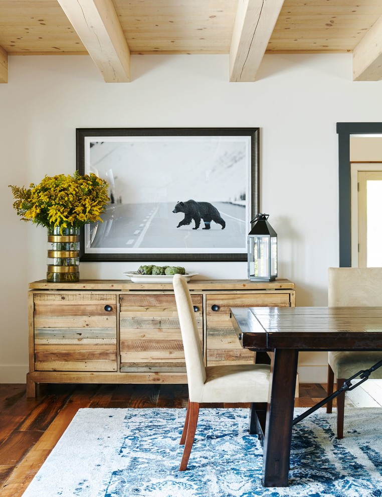 Inspiration for a rustic dark wood floor dining room remodel in New York with white walls
