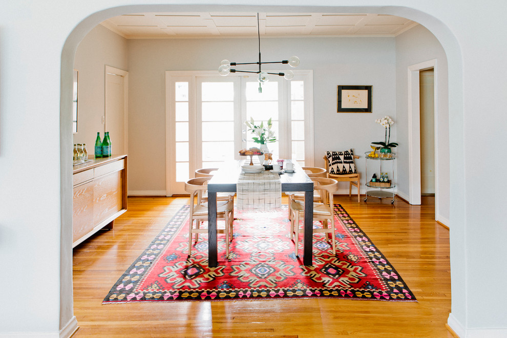 Inspiration for a small transitional light wood floor kitchen/dining room combo remodel in New York with gray walls and no fireplace
