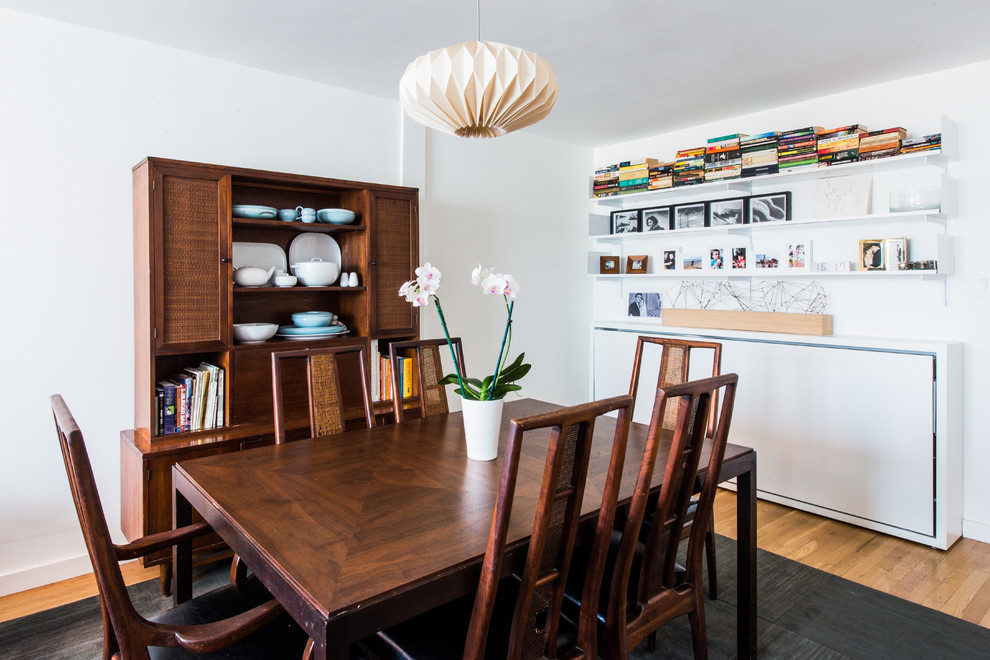 Inspiration for a mid-sized scandinavian medium tone wood floor kitchen/dining room combo remodel in New York with white walls and no fireplace