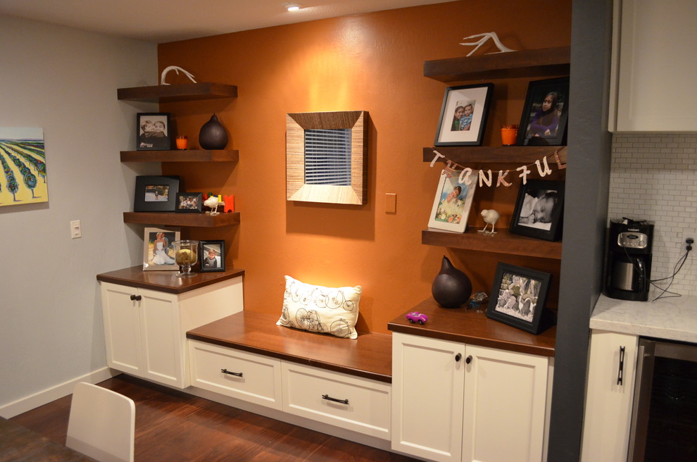 Trendy dark wood floor kitchen/dining room combo photo in Sacramento with orange walls and no fireplace