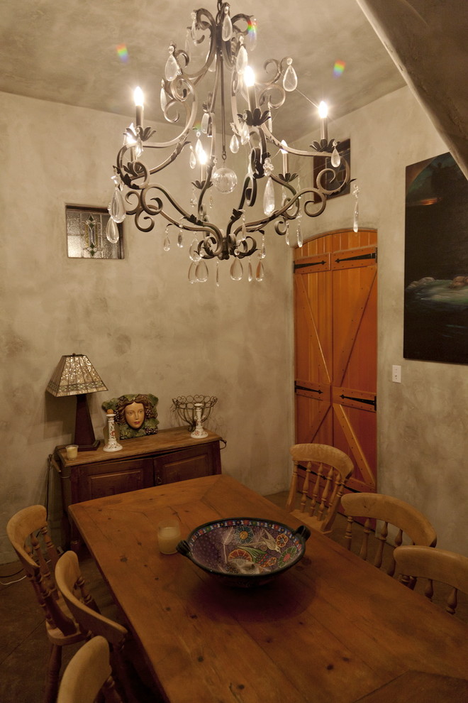Design ideas for a medium sized mediterranean enclosed dining room in Los Angeles with beige walls.