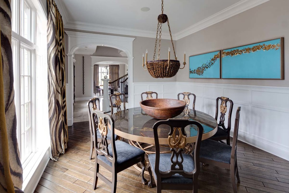This is an example of an eclectic dining room in Chicago with grey walls.