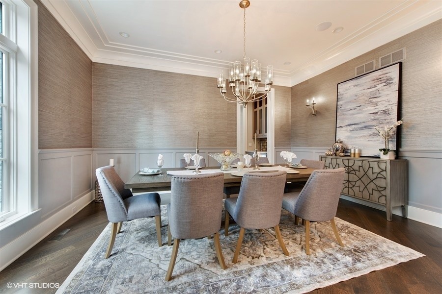 Inspiration for a large traditional enclosed dining room in Chicago with grey walls, medium hardwood flooring, no fireplace and brown floors.