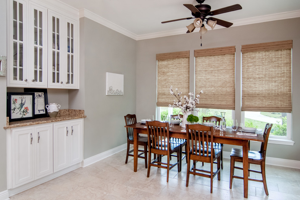 Kitchen/dining room combo - mid-sized traditional ceramic tile kitchen/dining room combo idea in New Orleans with gray walls and no fireplace