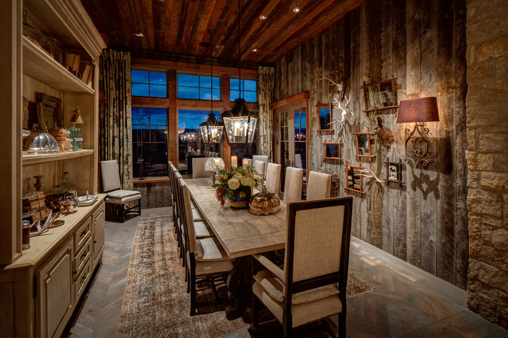 Rustic dining room in Salt Lake City with medium hardwood flooring, no fireplace, brown walls and brown floors.