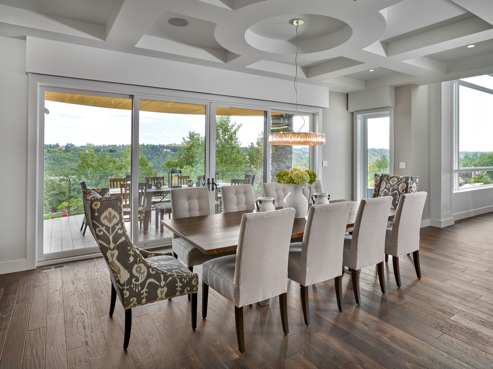 Design ideas for a traditional dining room in Edmonton with grey walls, dark hardwood flooring and brown floors.
