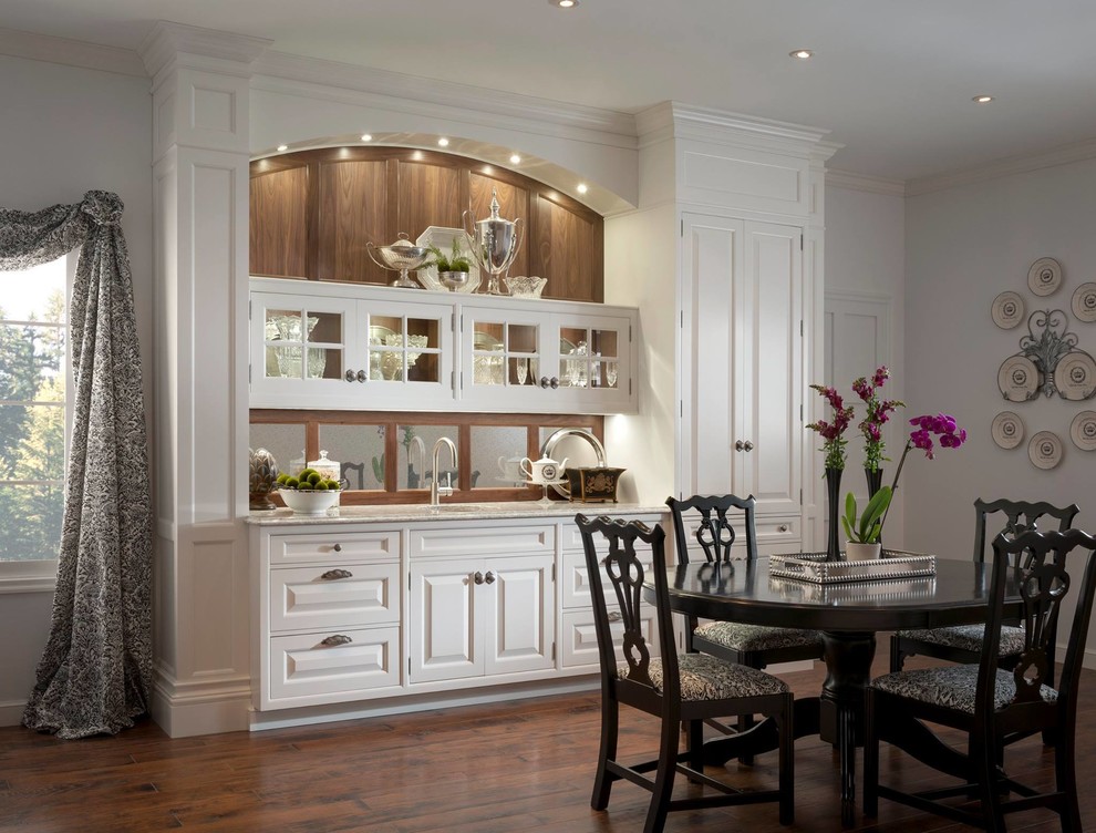 Inspiration for a large traditional kitchen/dining room in Houston with white walls and dark hardwood flooring.